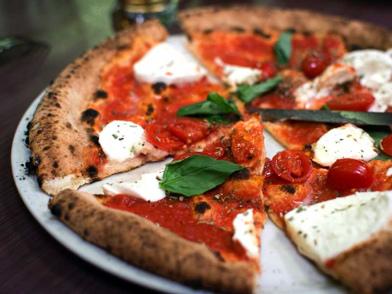 Simple italian pizza with cherry tomatoes